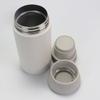 Taza térmica de acero inoxidable nueva para fabricantes, simple, taza japonesa, doble tapa, botella de leche, separación de té, taza portátil para acompañar