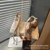 Estilo Japonês e Coreano da moda, simples e elegante, nova bolsa de ombro, de mão, transversal e de axila feminina de grande capacidade em formato de meia-lua para o outono de 2026