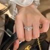 Anillo de diamantes rotos Xinghe con diseño irregular y apertura ajustable para mujer, ligero, de lujo, para celebridades de la alta sociedad.