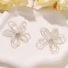 Estilo INS moda coreana simple flor hueca de plata DIY estilo minimalista pendientes para el día a día accesorios para orejas accesorios para el cabello accesorios de flor para zapatos