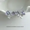 Pendientes de botón plisados con forma de lazo y circonita súper suaves y dulces para mujer, pendientes de nicho únicos y hermosos, nuevo modelo 2026 con un toque de alta gama