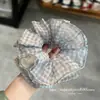 Selección PremiumElásticos elegantes y con estilo, nueva colección de accesorios para el cabello de nicho de alta gama para recoger el cabello en la parte posterior de la cabeza