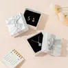 Nueva caja de joyería con lazo caja de regalo para collar, anillo, pendientes caja de embalaje para joyería en stock venta al por mayor