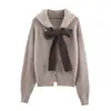 Chaqueta con capucha de punto con lazo estilo europeo y americano transfronterizo 2025 Nueva Moda Elegante para Mujer Venta al por mayor 5536129