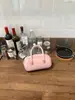 Elegante bolsa de boliche de mano para mujer, nuevo bolso de hombro de moda primavera/verano 2026, bolso cruzado versátil para el trabajo