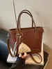 Bolso de mujer de nicho de alta gama transfronterizo 2026 nueva moda versión coreana bolso cruzado, bolso cubo de mano simple súper popular