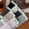 Nuevos calcetines de mujer sin costuras para otoño e invierno, de color liso, con volantes, de longitud media hasta la pantorrilla, calcetines de algodón modernos y versátiles, calcetines holgados estilo universitario