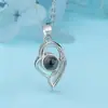 Nuevo Colgante 100 Idiomas Te Amo Nano Micro Tallado Proyección Collar Regalo de Confesión para Pareja Collar Creativo