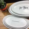 Venta directa de fábrica de platos ovalados para pescado de cerámica blanca pura con borde grueso, adecuados para uso en hoteles, restaurantes y cenas en casa.