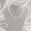 Estilo de vacaciones de playa simple transfronterizo europeo y americano, perla de imitación, personalidad hecha a mano, cadena trasera con borla sexy temperamental