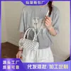 Bolsa de mano casual simple de nuevo estilo para la primavera de 2026, bolsa tote pequeña, bolsa tipo almohada de lunares para mujer, bolsa de hombro único, bandolera