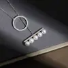 Collar de perlas de viga de equilibrio