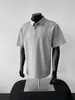 Camiseta de Manga Corta con Diseño de Empalme Desestructurado Hombro Derecho Polo Americano de Alta Gama Color Sólido Simple Holgada Media Manga para Hombre