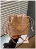 Nuevos bolsos de mano para mujer, bolsos de mujer transfronterizos, bolsos cruzados, bolsos tipo cubo, bolsos de hombro versátiles de cuero genuino de alta gama exquisitos