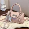 Bolso de mano de bowling de nicho de alta gama para mujer, piel brillante, nuevo bolso versátil de moda para chicas a la moda, adecuado para ir al trabajo, bolso de hombro y cruzado