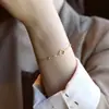 Pulseira e Colar Flor de Trevo de Quatro Folhas de Luxo Leve Sem Cor para Mulheres 2025 Novo Corrente de Clavícula Popular de Celebridade Cibernética para o Verão
