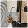 Bolsos de nicho transfronterizos para mujer, nuevo bolso de hombro tipo cubo de lunares de moda otoño 2026, bolso cruzado para el día a día