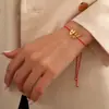 Comercio exterior nuevo pulsera de amor de acero inoxidable tejida a mano cuerda roja corazón pulsera dorada joyería para amantes novias