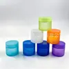Vendas diretas da fábrica: Diâmetro de 57 mm, frascos de cânhamo de 2 oz com tampas coloridas pintadas por spray, disponíveis em qualquer cor para uso como potes de creme