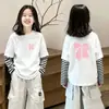 Camiseta infantil listrada de manga longa 2026 novo modelo de algodão puro top moderno e estiloso super fofa roupa de menina