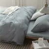 Juego de cuatro piezas de algodón 100% teñido en hilo y lavado, algodón puro, sin marca, suministrado por el fabricante, funda de edredón de alta calidad, sábana bajera de estilo japonés, ropa de cama al por mayor
