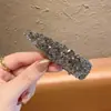 Pinza para el pelo de pato con pedrería Dongdaemun coreana para mujer 2026 Nuevo estilo de alta gama versátil Pinza para el flequillo lateral para mujer