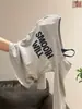 Camiseta de manga longa cinza outono estilo coreano, um ombro só, ombro a ombro, acinturada, 2026, base, blusa falsa de duas peças para mulheres