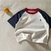 Camiseta infantil de manga corta 100% algodón 2026 nueva versátil moda simple elegante top para niños y niñas, bebés y niños pequeños, verano