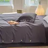 Estilo japonés Nube algodón suave lavado estilo sin estampado botón juego de cuatro piezas individual doble color sólido sábana sábana ajustable juego de tres piezas