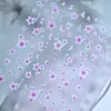 Adesivos para nail art de estrela e flor de pessegueiro em relevo, apresentando um design tridimensional em relevo com pequenas flores, um efeito degradê e um estilo fresco e doce; auto-adesivo