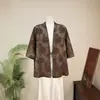 Blusa jacquard de estilo chino nuevo Zhi Li de manga tres cuartos con lazada, nuevo top holgado vintage de otoño 2026