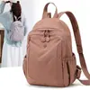 Mochila de tela de nailon impermeable 2026 para mujer, ligera, con múltiples compartimentos, elegante y versátil para viajes, comercio exterior transfronterizo