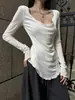 Camiseta blanca de manga larga con volantes irregulares para mujer, nuevo diseño nicho de principios de otoño, entallada a la cintura, top de alta gama, estilo ins
