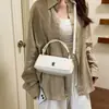 Popular bolso de mano pequeño cuadrado de un solo hombro estilo coreano 2026, nuevo bolso de nicho, bolso de mano de moda para ir al trabajo, bolso cruzado para mujer