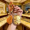 Llavero de Oro Año de la Oveja Ten Dinero para Gastar Llavero de Teléfono de Oveja Pequeña Colgante para Bolso Caja de Regalo de Año Nuevo Controlador de Tráfico de Transmisión en Vivo