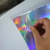 Película plástica de PVC para láser película iridiscente papel de color reflectante PET película de color colorido película de rejilla de color mágico película de PP de color degradado