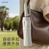 Paraguas con Hebilla 70% de descuento Manual de Negocios Portátil Plegable al por Mayor Reforzado Anti-UV Recubrimiento Negro Paraguas de Sol