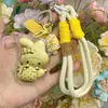 Venta al por mayor de Cadenas para Teléfono Melody Gold, Dijes para Bolsos y Llaveros Hechos de Oro Puro 999, Mismo Estilo que Shuibeike