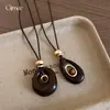 Otoño e Invierno Resina Geométrica Hueca Piedra Ojo de Tigre Colgante Collar Accesorios Cadena para Suéter de Mujer Lujo Ligero Collar de Gama Alta