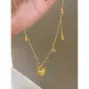 Jinqi nuevo retro buena suerte Lili método antiguo bolsa con cierre collar proceso de tallado a cincel temperamento exquisito todo partido sentido de alta gama cadena