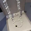 Aleación Circonia Trébol de Cuatro Hojas Collar Largo Doble Cara Estilo Largo Europeo y Americano Estilo Gótico Abalorio Perlas de Doble Capa