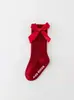 Nuevos calcetines largos de rayas de color sólido para niños y niñas, algodón-poliéster antideslizantes con parte superior de burbuja, calcetines de media pantorrilla con lazo para bebé al por mayor