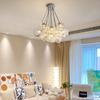 Lámpara de diseño de estilo nórdico para sala de estar, moderna, sencilla, creativa, con bloques de hielo de piedra, lámpara de comedor personalizada, lámpara de dormitorio color crema.