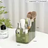 Portalápices cosmético de escritorio de tres y cuatro compartimentos Contenedor de almacenamiento de maquillaje Estante de almacenamiento trapezoidal Caja de almacenamiento de escritorio compartimentada
