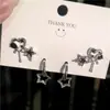 Brincos de tarraxa novos transfronteiriços de nicho ins de luxo leve com óleo preto pingado adoráveis brincos de estrela de cinco pontas em forma de gota d'água femininos conjunto de 3 peças