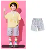 Traje de porrista para el Día del Niño para estudiantes de primaria, conjunto de uniforme de clase para el día del deporte escolar, disfraz de lunares con falda corta para jardín de infantes