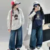 Camiseta base de manga de lunares de dos piezas falsas para niñas de otoño 2026 nueva moda coreana de algodón holgada para niños mayores