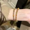 Nova Pulseira de Sandáliao de Madeira de Sândalo Dourado Flutuante Estilo Chinês Círculo Duplo Empilhado Vintage Fresca e Discreta com Contas Sandáliao de Madeira de Sândalo Nicho Joia para Mão