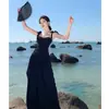 Conjunto de Dos Piezas: Top Tubo Negro + Falda Larga Acampanada de Cintura Alta para Vacaciones en la Playa, Verano, Adelgazante y Elegante