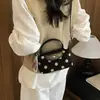 Bolso pequeño de ante para mujer, nuevo modelo 2026, bolso de mano con diseño de nicho, bolso de hombro y bandolera versátil de alta gama